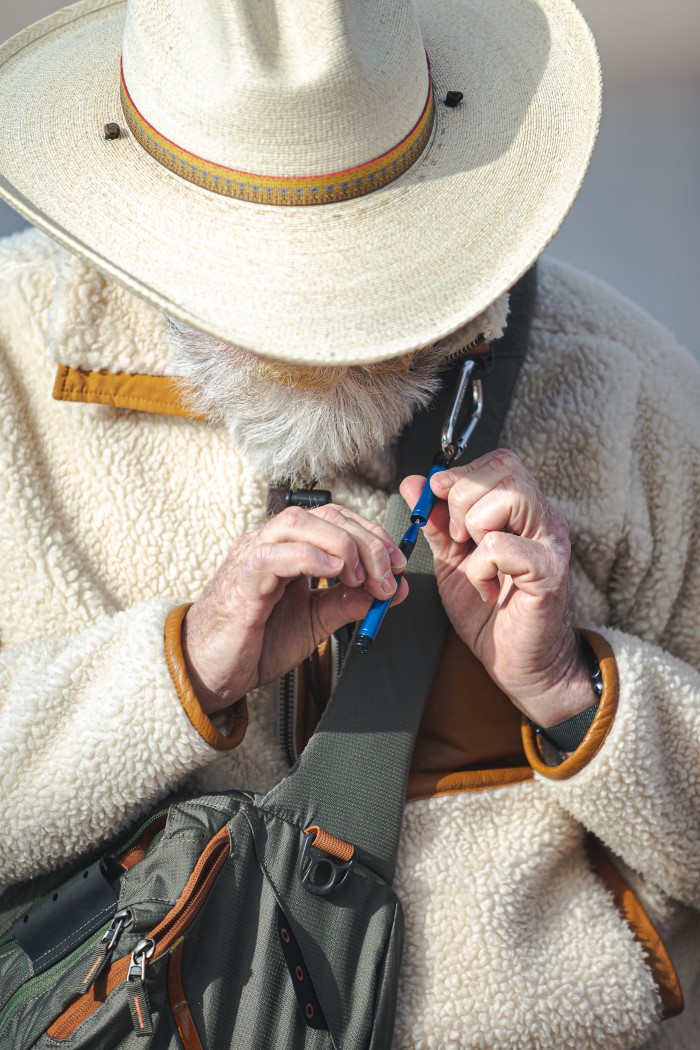 Blue Backpacker on carabiner