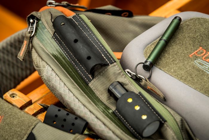 Green Backpacker attached to bag