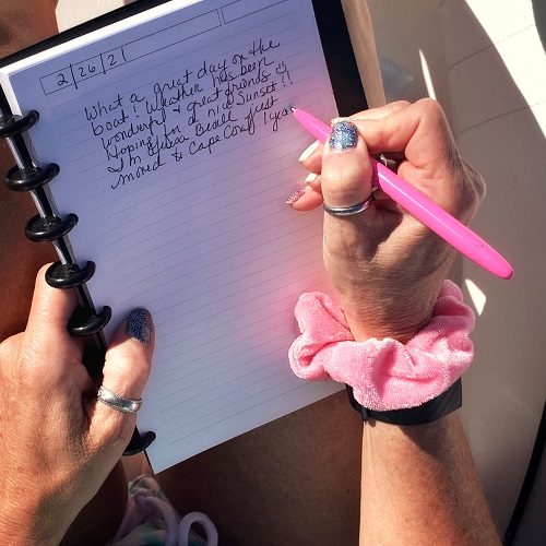 400PK writing in notebook