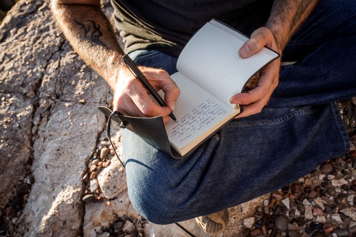 M4B used outdoors to write in notebook
